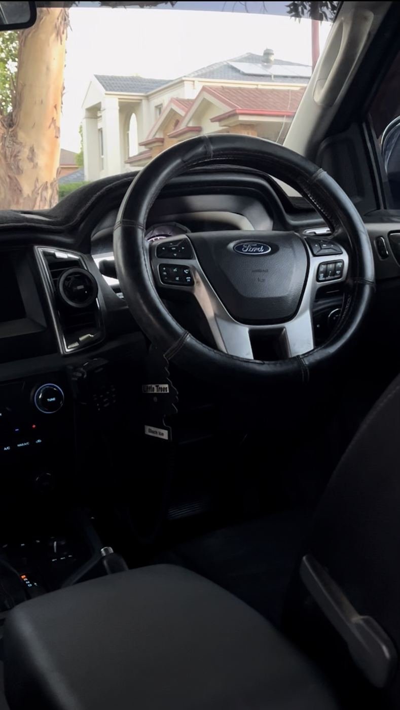 Ford cabin with a cleaned steering wheel and dash